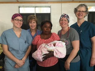 Drs standing with patient and baby.jpg