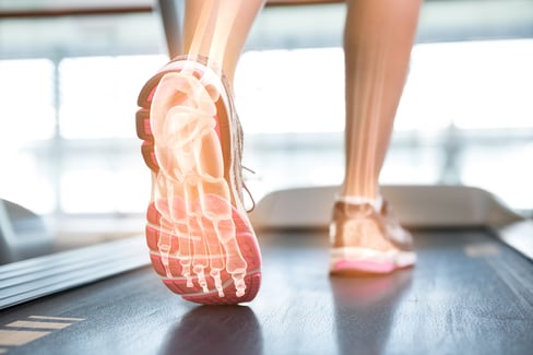 Digital composite of Highlighted foot of woman on treadmill-1