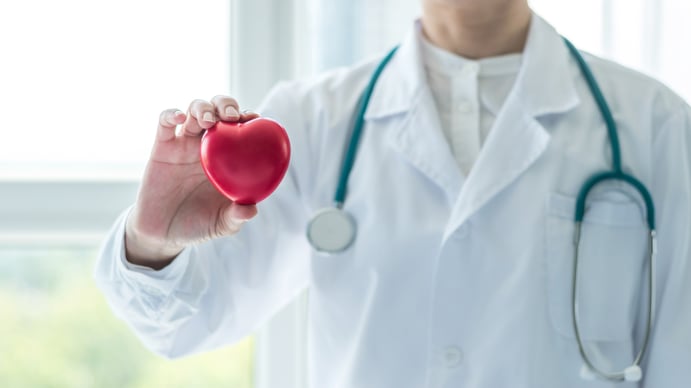 Doctor holding red heart