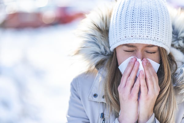 women-blowing-nose-outside-in-winter
